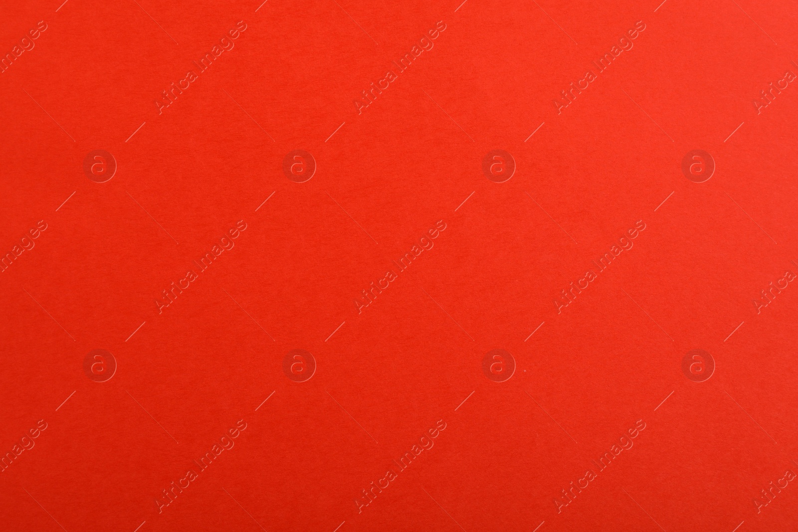 Photo of Abstract red background, top view. Colorful paper