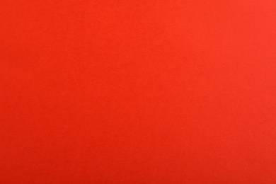 Photo of Abstract red background, top view. Colorful paper