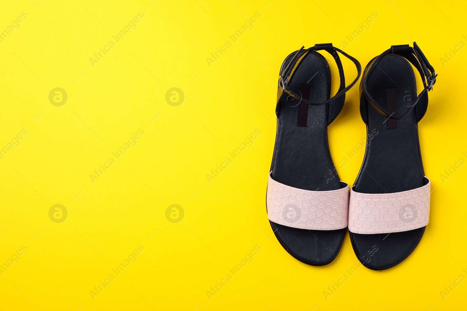 Photo of Pair of trendy women's shoes on color background, top view