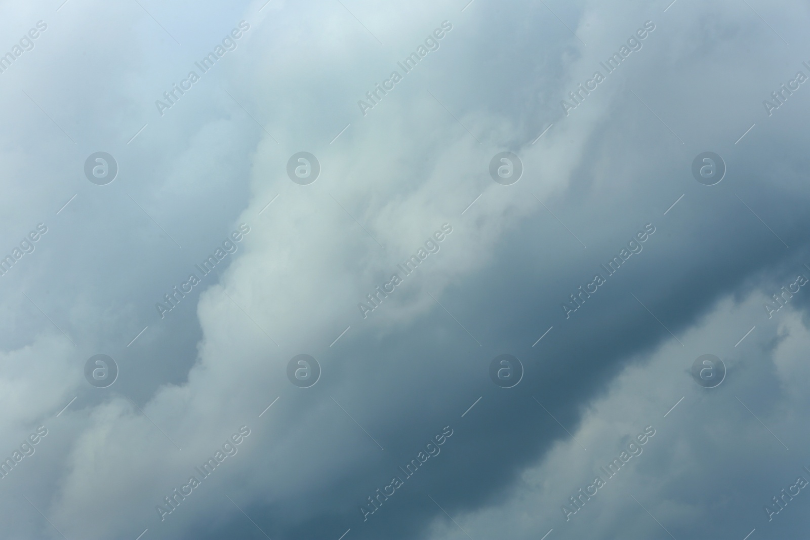 Photo of Sky with heavy rainy clouds on grey day