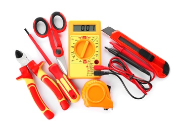 Set of electrician's tools on white background, top view