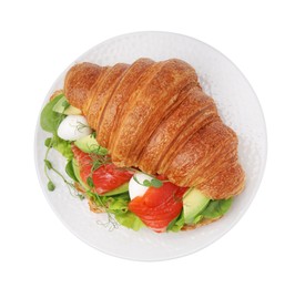 Tasty croissant with salmon, avocado, mozzarella and lettuce isolated on white, top view