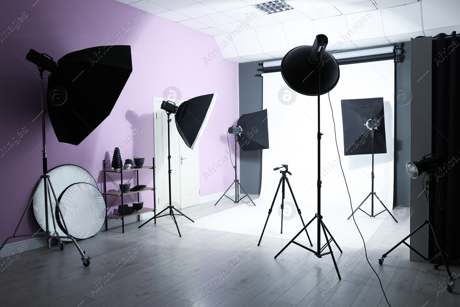 Photo of Interior of modern photo studio with professional equipment