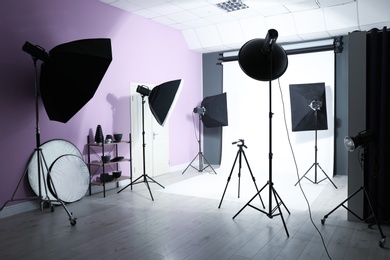 Interior of modern photo studio with professional equipment