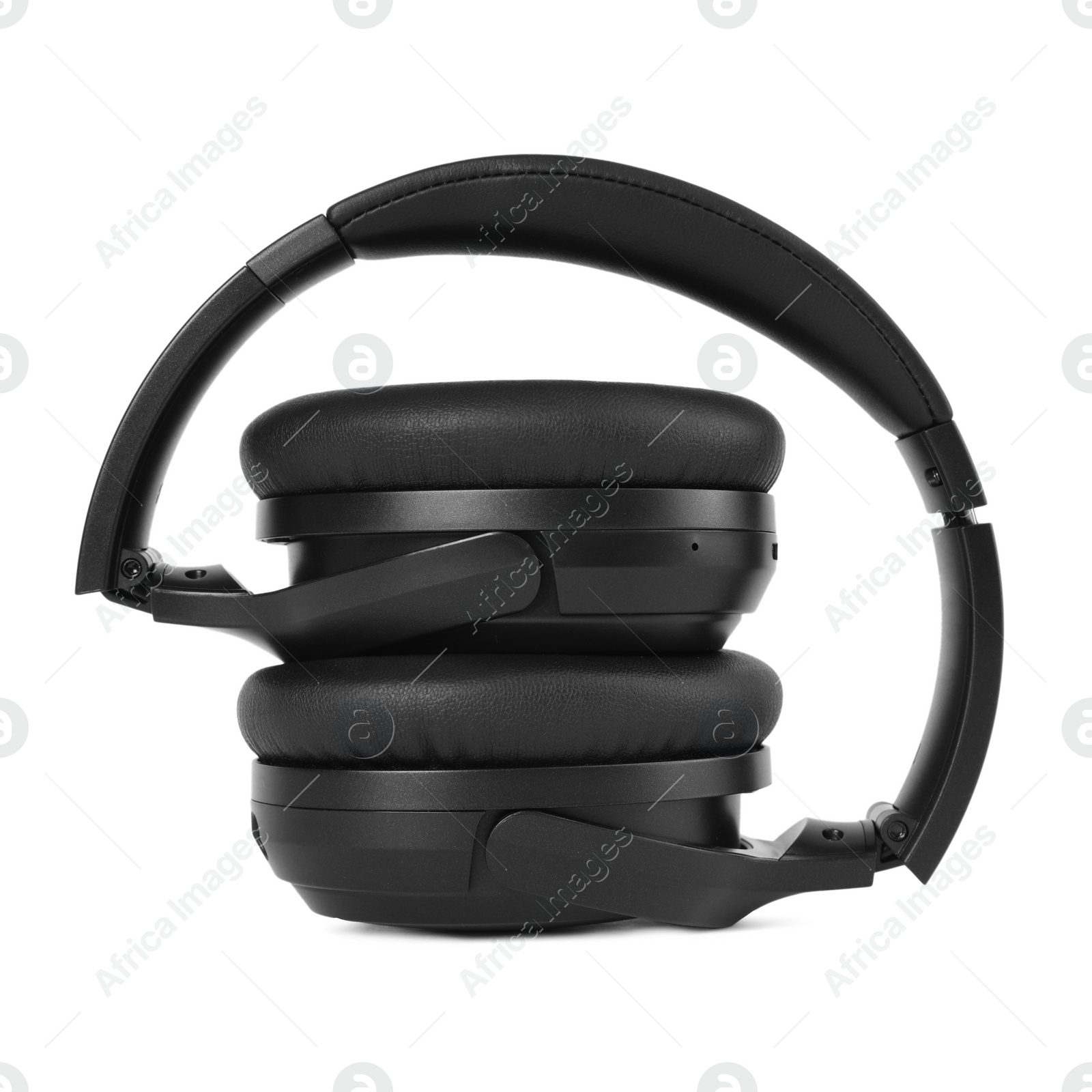 Photo of Modern black wireless headphones isolated on white