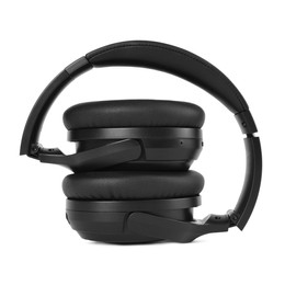 Photo of Modern black wireless headphones isolated on white