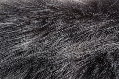 Photo of Texture of grey faux fur as background, closeup