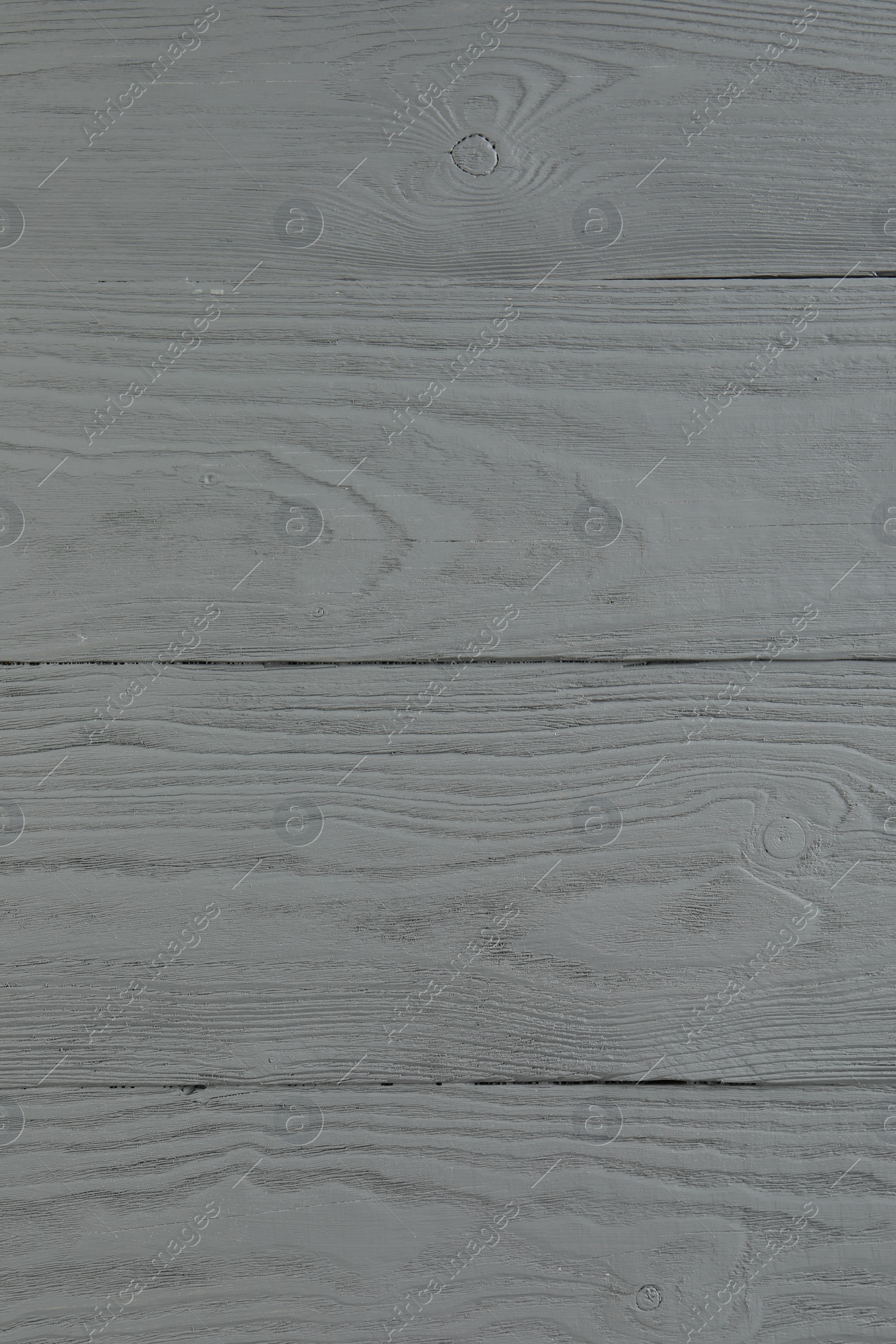 Photo of Texture of light grey wooden surface as background, closeup