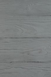 Photo of Texture of light grey wooden surface as background, closeup