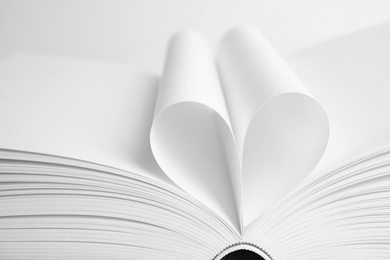 Closeup view of open book on white background