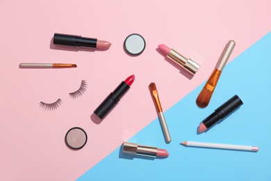 Photo of Flat lay composition with cosmetic products on color background