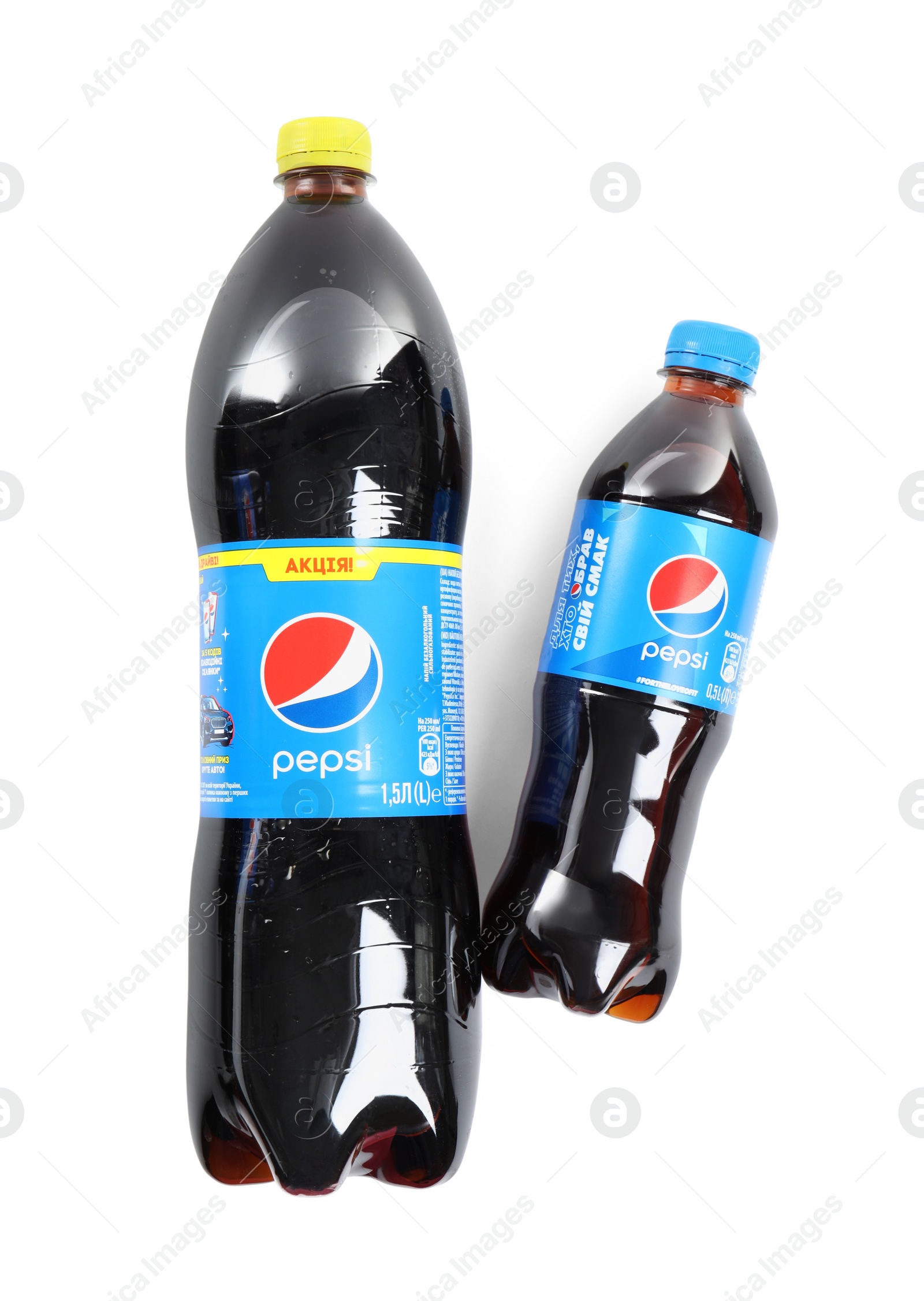 Photo of MYKOLAIV, UKRAINE - FEBRUARY 10, 2021: Bottles of Pepsi on white background, top view