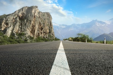 Empty asphalt road in mountains, low angle view