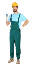 Photo of Professional repairman in uniform with smartphone on white background