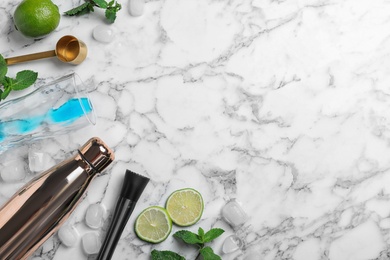 Photo of Flat lay composition with ingredients for cocktail and bar equipment on white marble background. Space for text