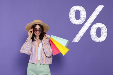 Image of Discount offer. Happy woman with paper shopping bags and chalked percent sign on purple background
