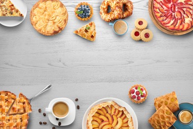 Image of Flat lay composition with different delicious pies on white wooden table. Space for text