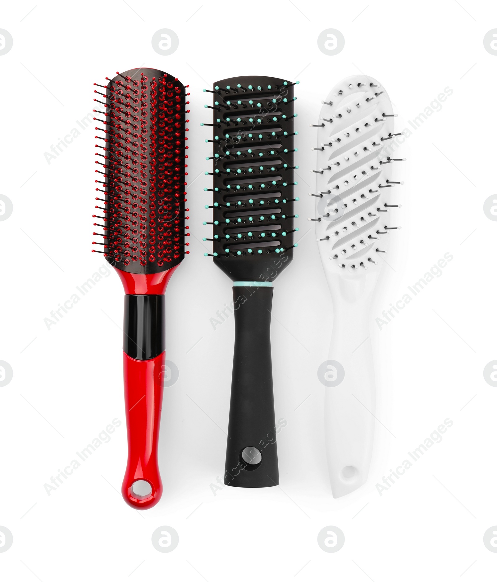 Photo of Set of plastic hair brushes isolated on white, top view