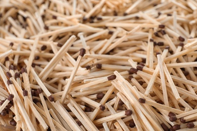 Pile of wooden matches as background, closeup