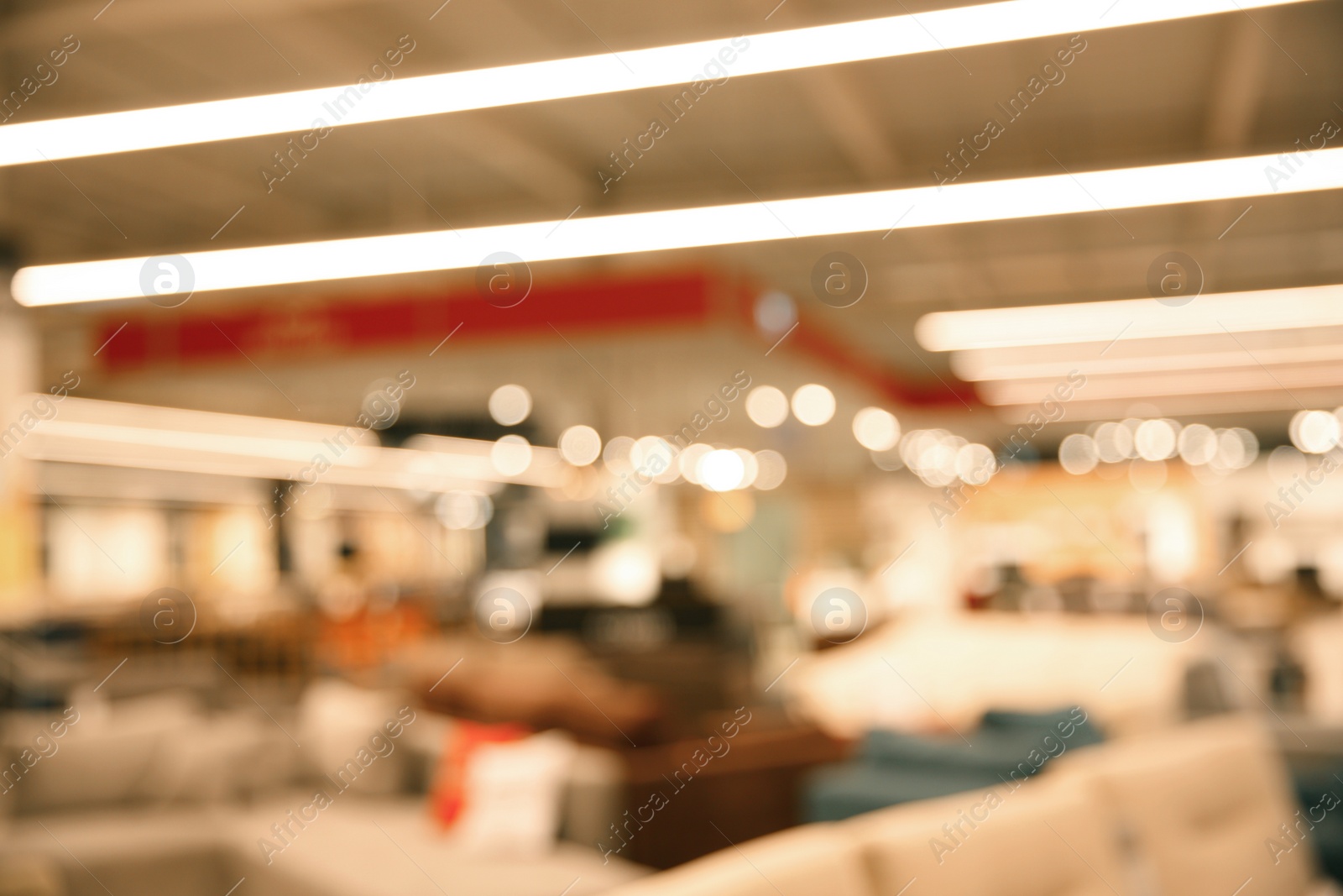 Photo of Blurred view of modern shopping mall interior