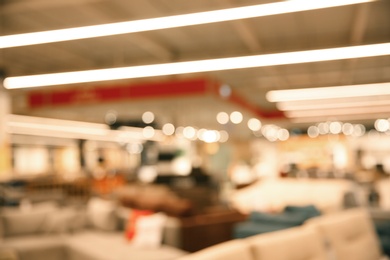 Photo of Blurred view of modern shopping mall interior