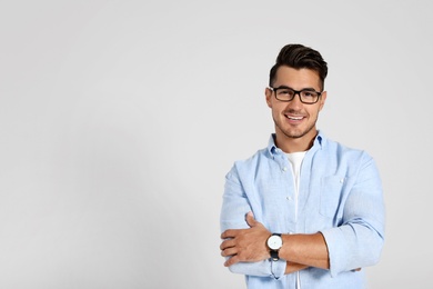 Portrait of handsome young man and space for text on white background