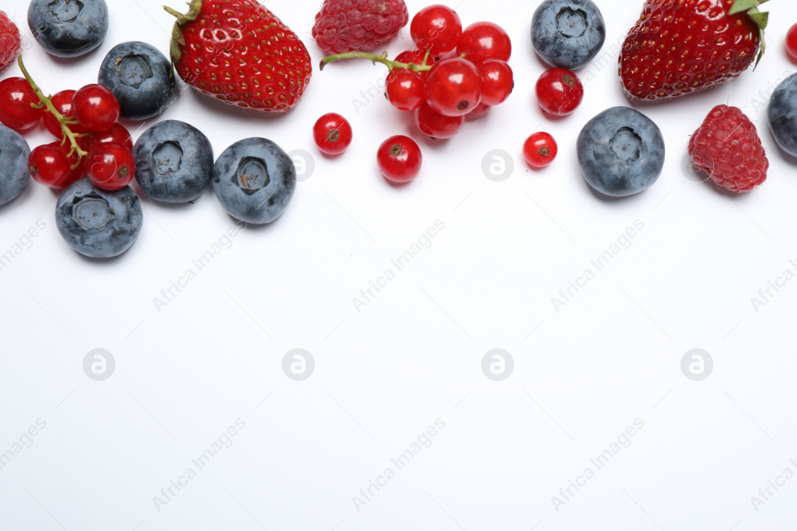 Photo of Mix of fresh berries on white background, flat lay