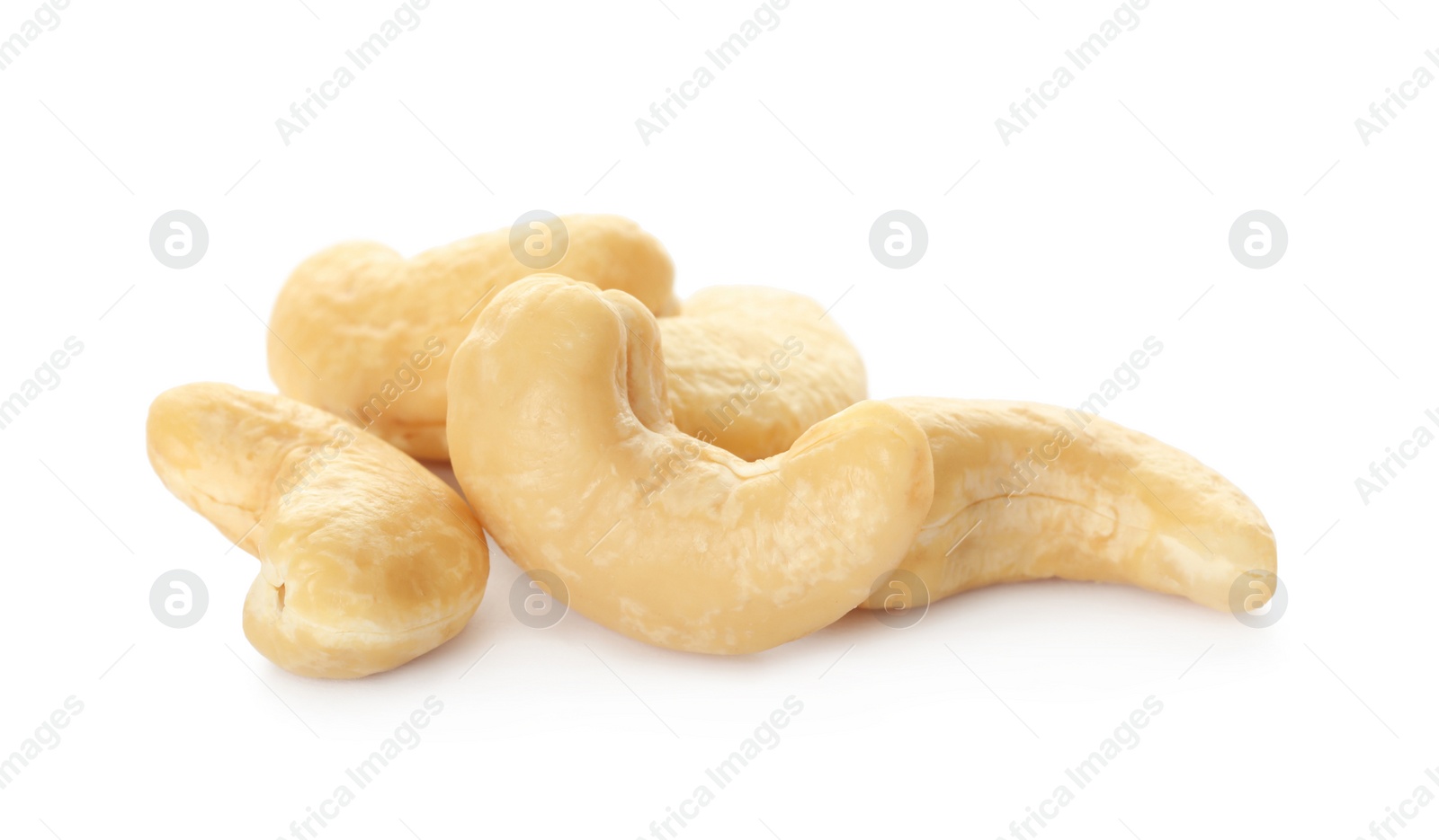 Photo of Pile of tasty organic cashew nuts isolated on white