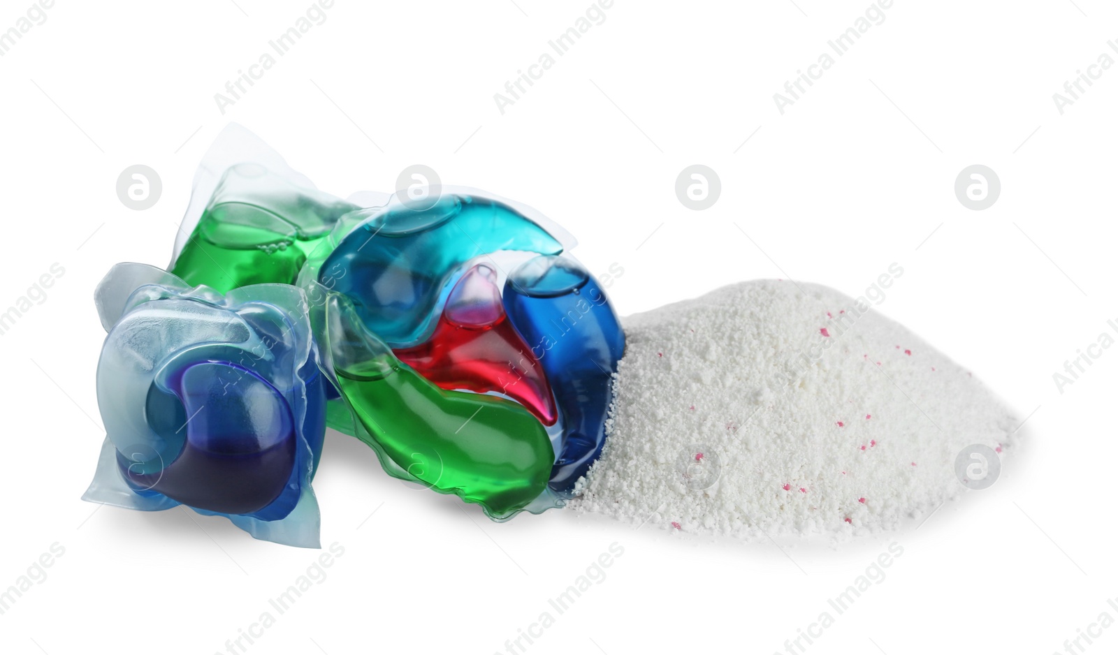 Photo of Color laundry capsules and detergent powder on white background