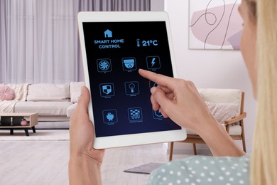Image of Woman using smart home control system via application on tablet indoors, closeup