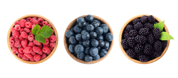 Set of bowls with different fresh berries on white background, top view. Banner design