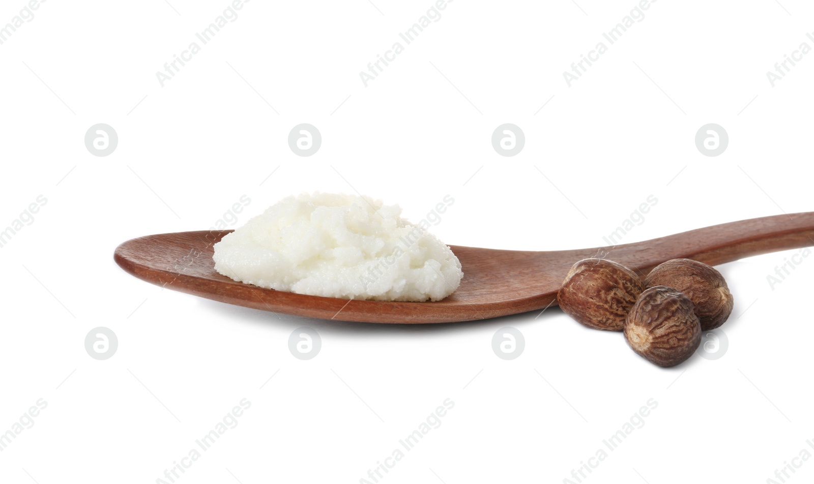 Photo of Shea butter in wooden spoon and nuts isolated on white