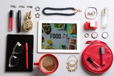Photo of Flat lay composition with tablet and  accessories on light background. Professional blogger