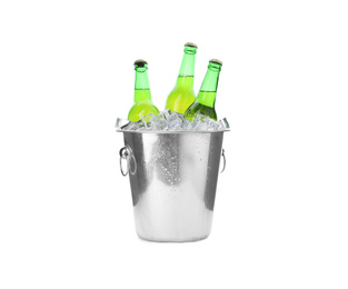 Photo of Metal bucket with bottles of beer and ice cubes isolated on white