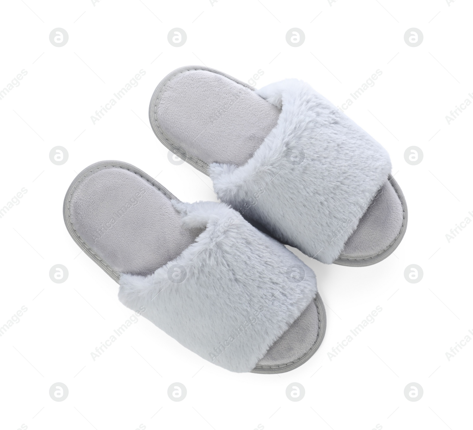 Photo of Pair of soft slippers with fur isolated on white, top view