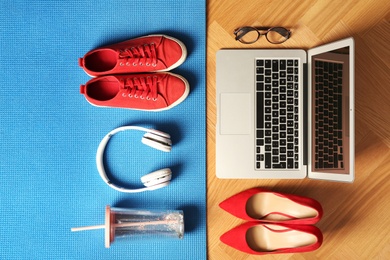 Photo of Flat lay composition with business items and sport accessories on color background. Concept of balance between work and life