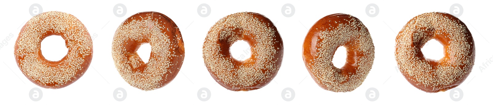 Image of Set with tasty fresh bagels on white background. Banner design