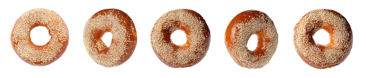 Image of Set with tasty fresh bagels on white background. Banner design