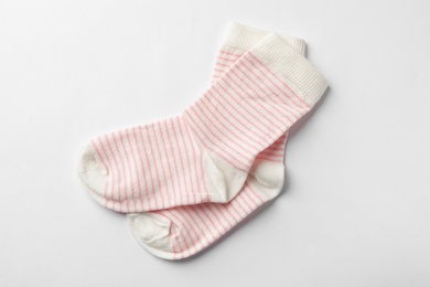 Cute child socks on white background, top view
