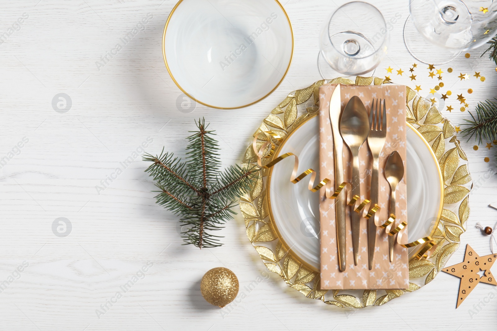 Photo of Elegant table setting and space for text on light background, top view. Christmas celebration
