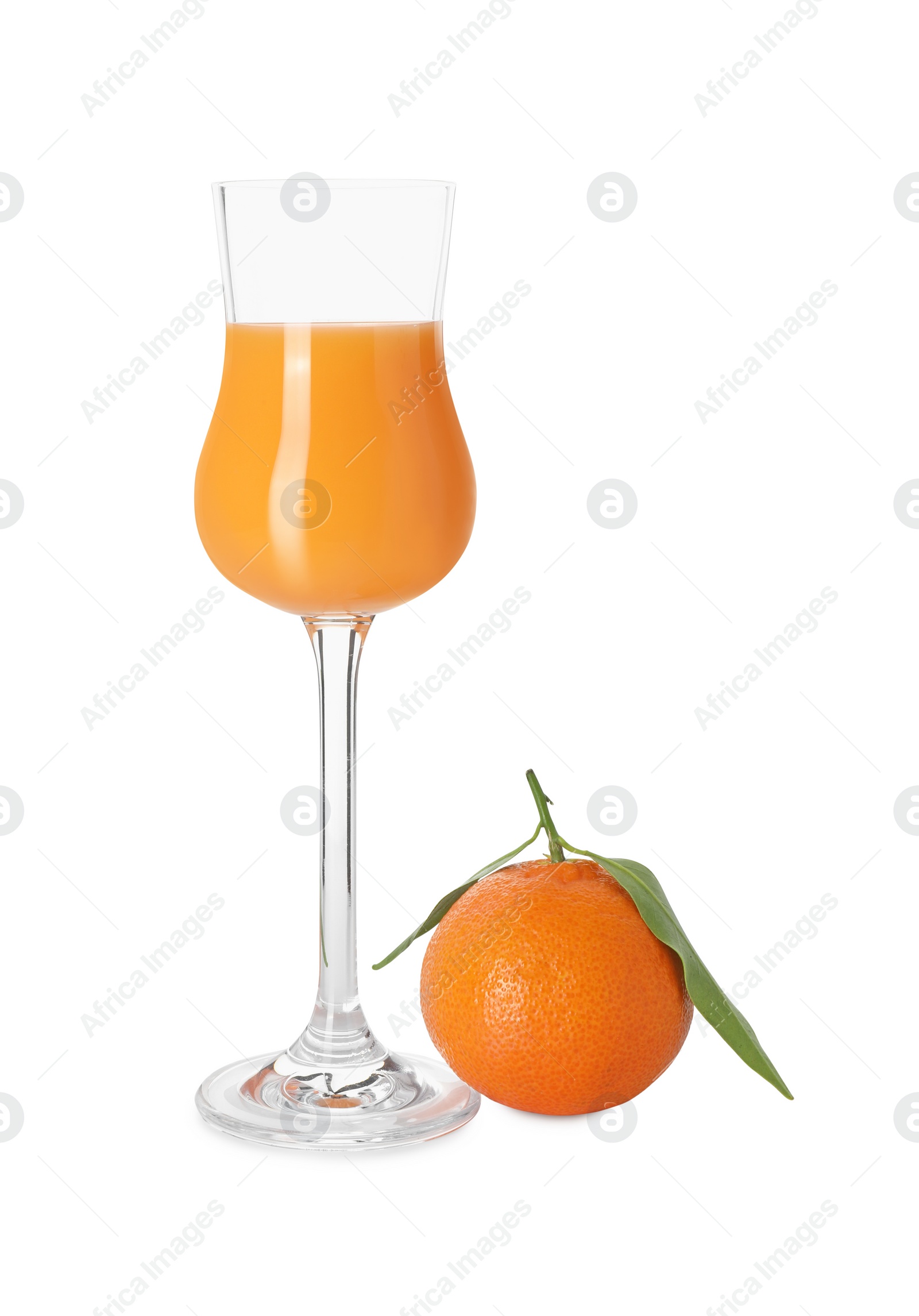 Photo of Glass with tasty tangerine liqueur and fresh fruit isolated on white