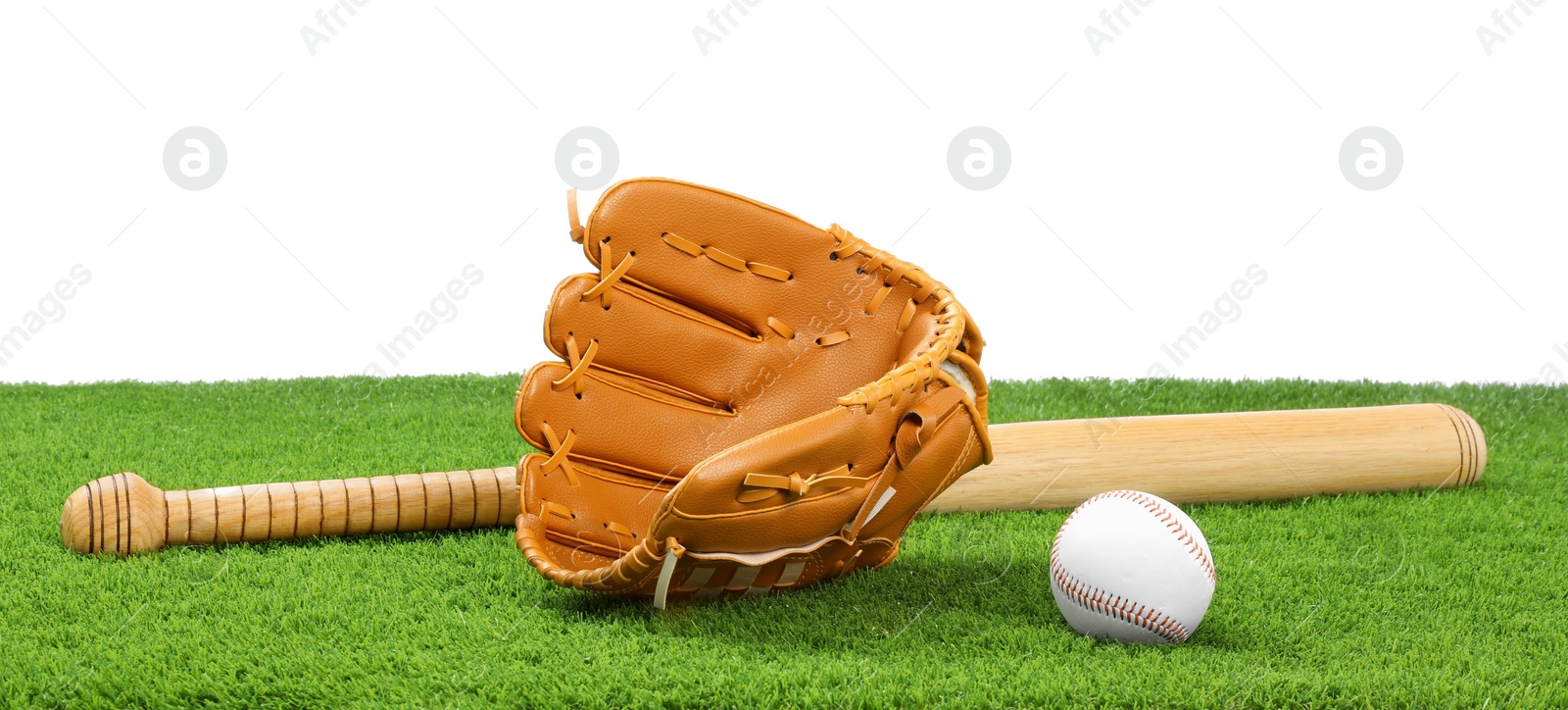 Photo of Baseball bat, ball and catcher's mitt on artificial grass against white background