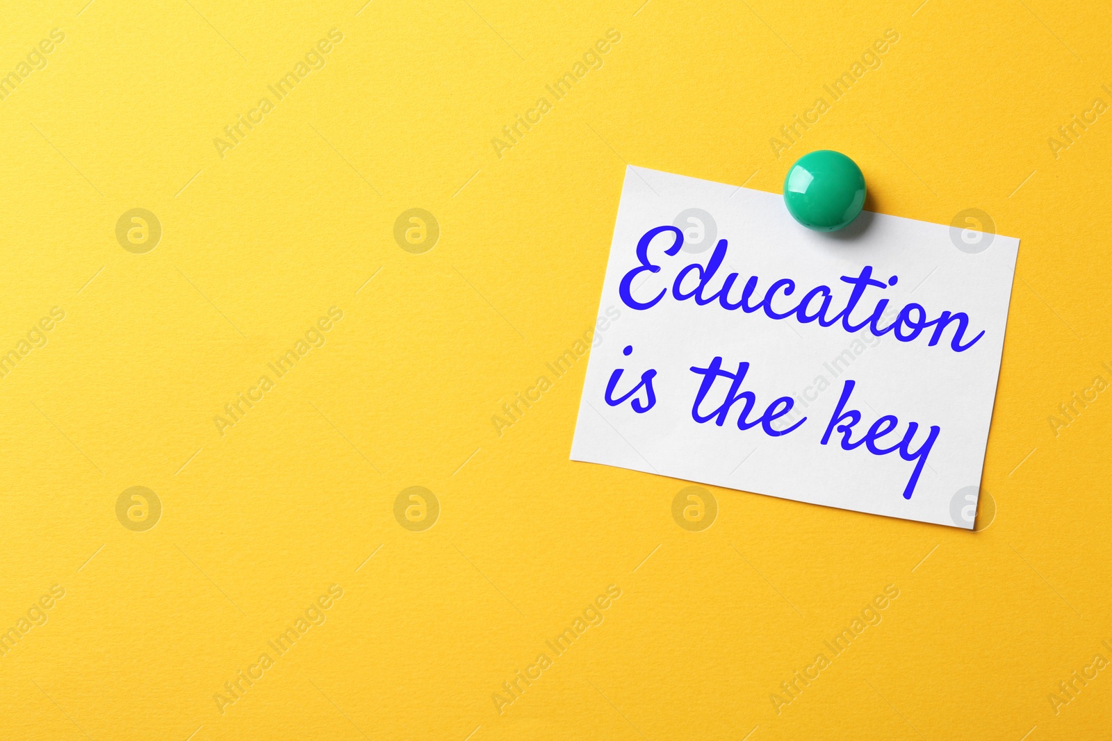 Image of Paper note with text Education is the key on yellow background. Adult learning