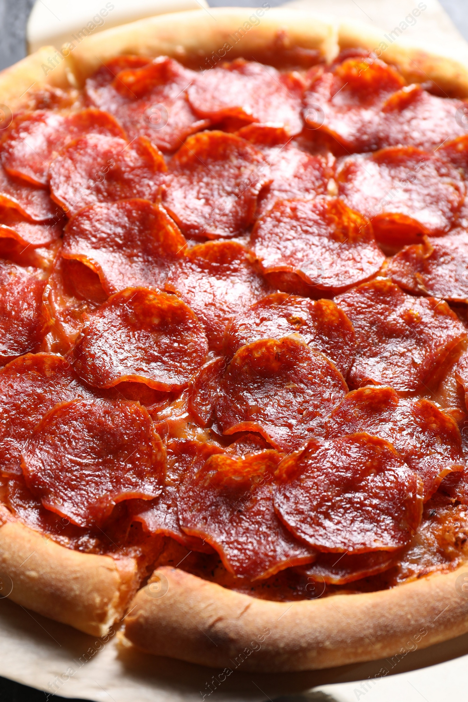 Photo of Tasty hot pepperoni pizza on table, closeup