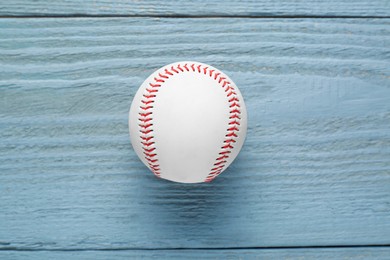 Baseball ball on grey wooden table, top view