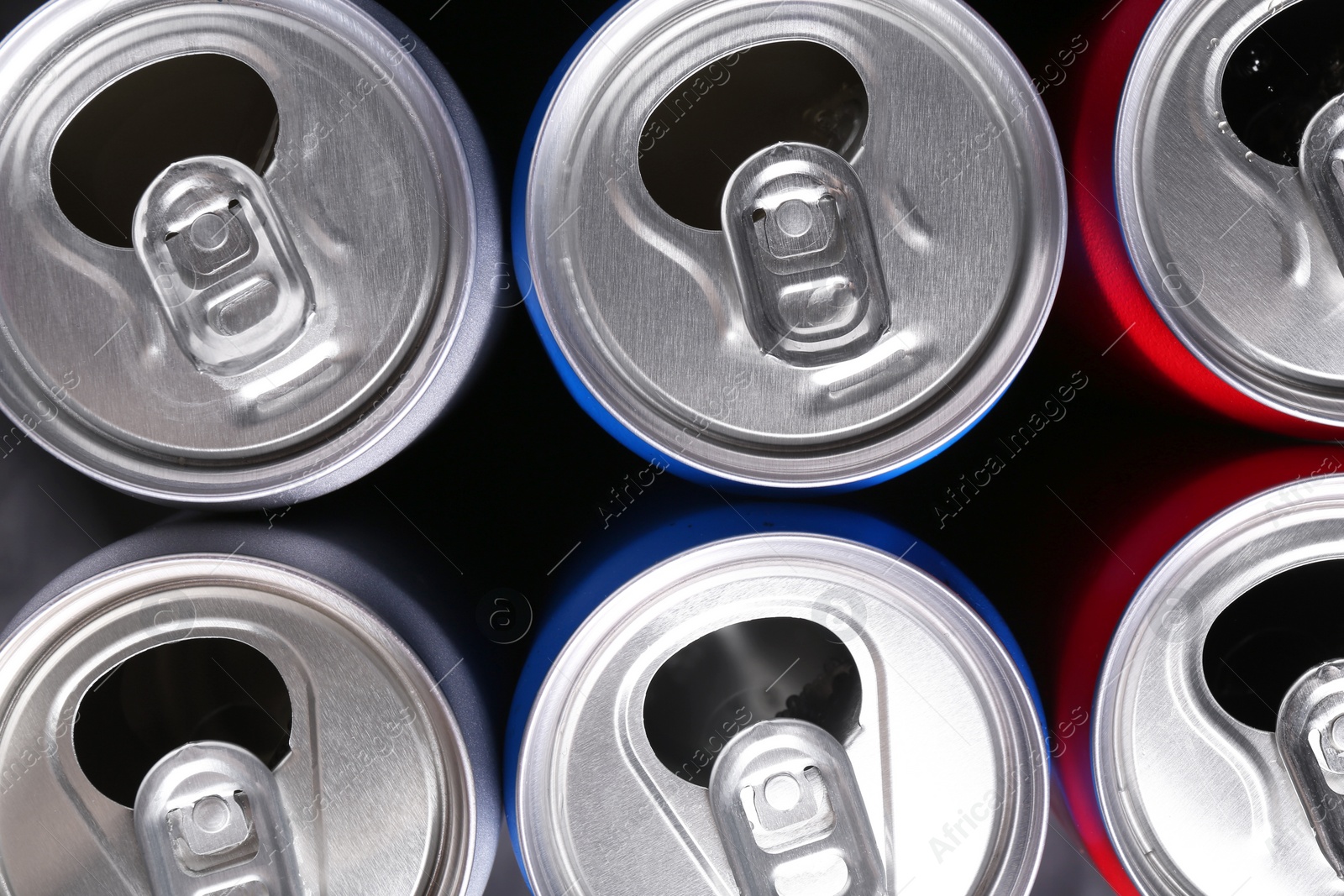 Photo of Energy drinks in cans as background, top view. Functional beverage