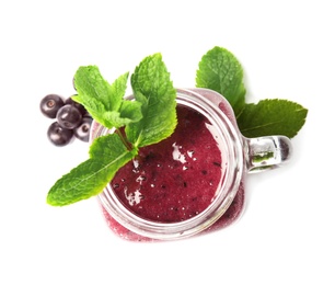 Mason jar with delicious acai smoothie on white background