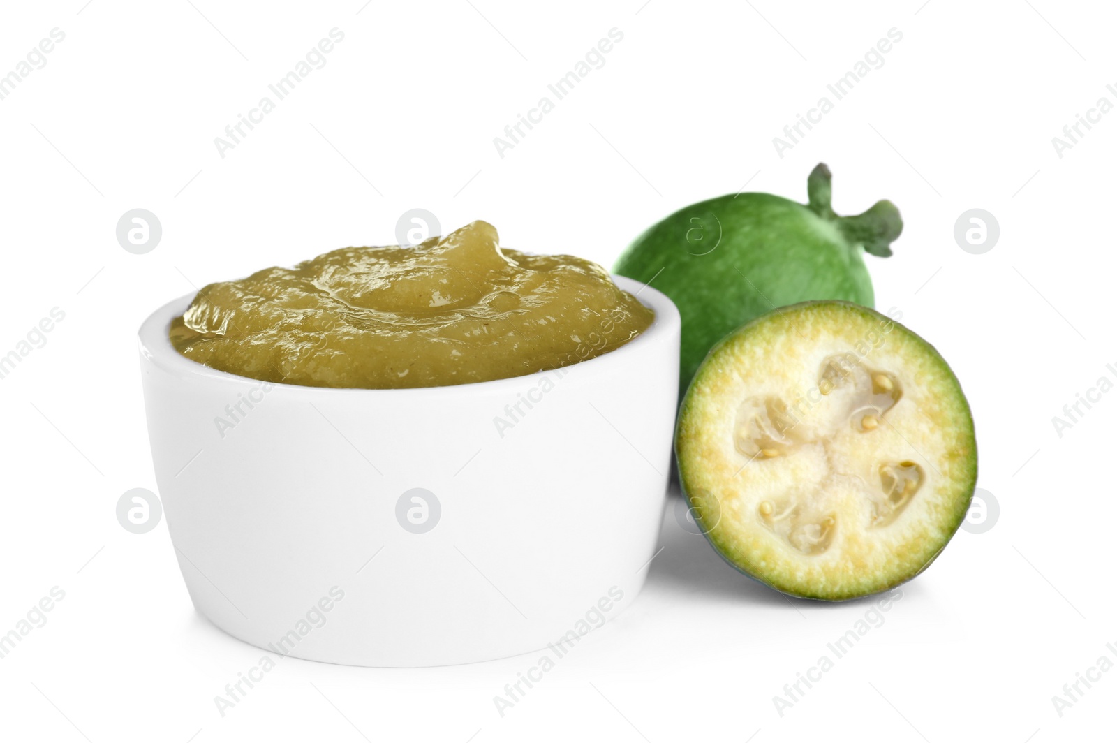 Photo of Feijoa jam in bowl and fresh fruits on white background