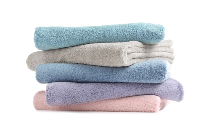 Photo of Stack of clean soft towels on white background