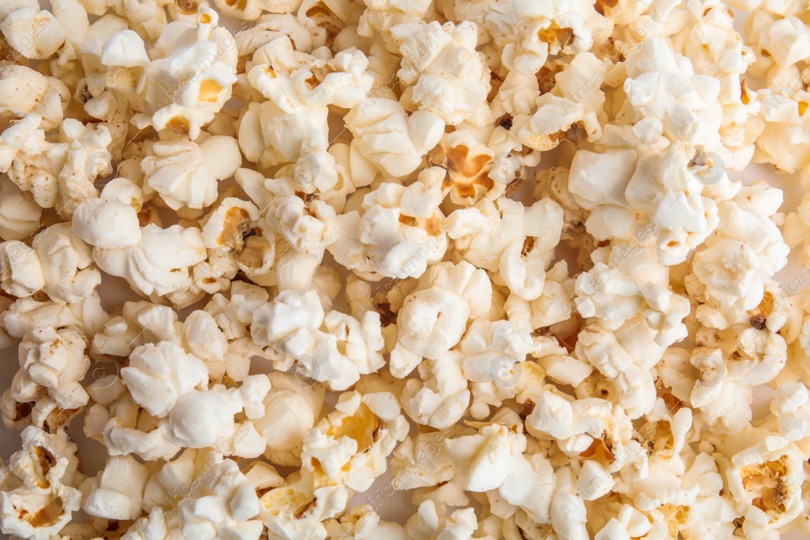 Photo of Tasty fresh pop corn as background, top view